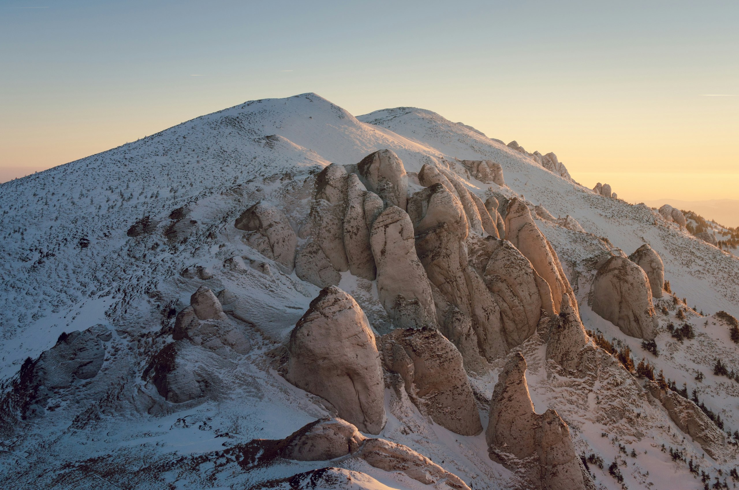 big rock formations covered with snow